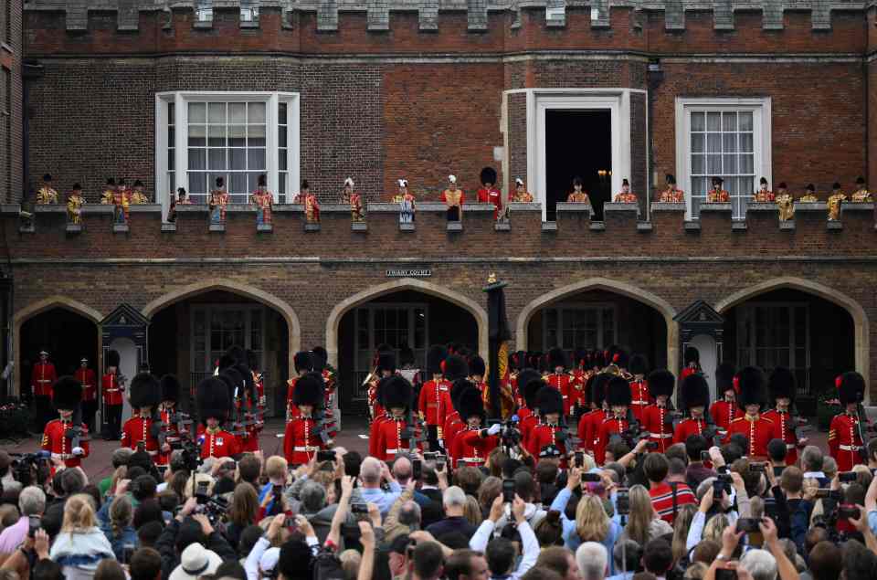 Crowds watch the proclamation at St James' Palace