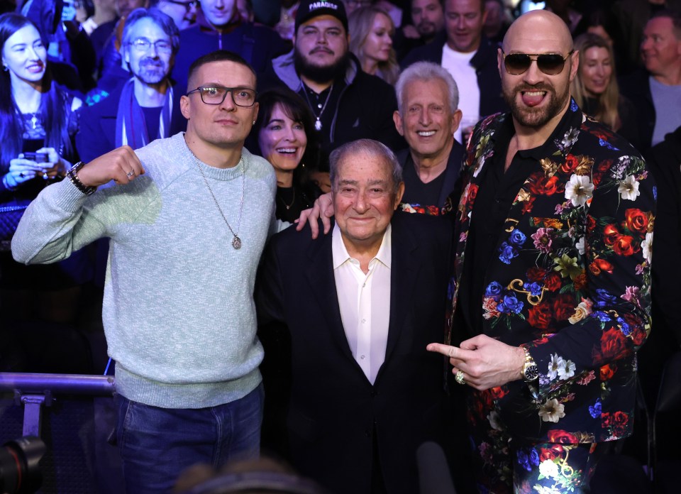 Oleksandr Usyk with promoter Bob Arum and Tyson Fury