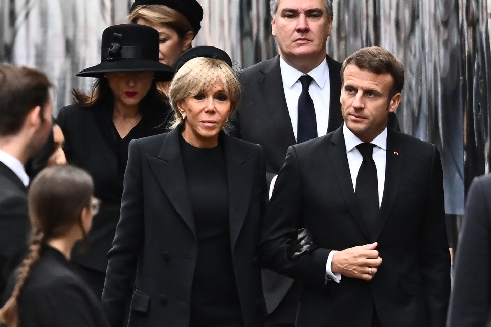 French President Emmanuel Macron and his wife Brigitte Macron walking into the Abbey