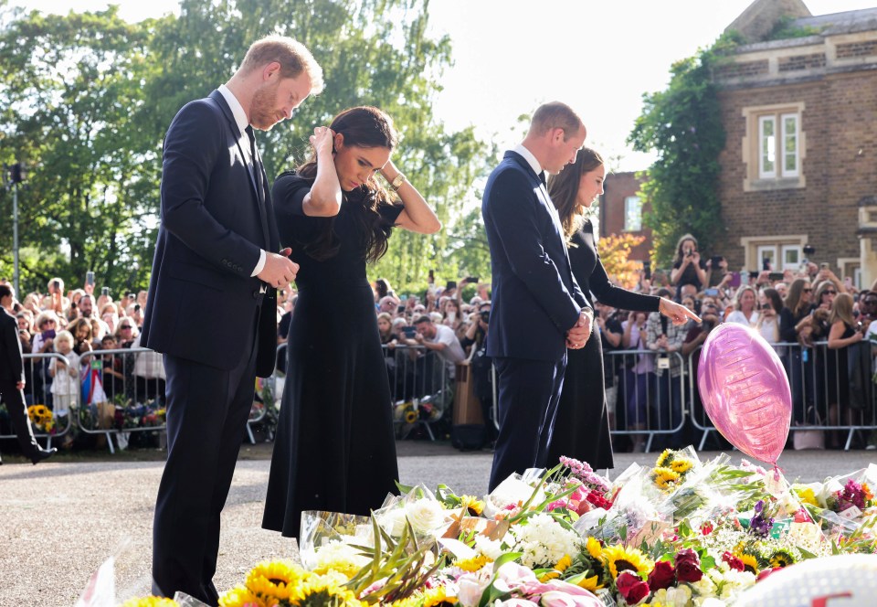 The once-named 'Fab Four' viewed floral tributes to the Queen