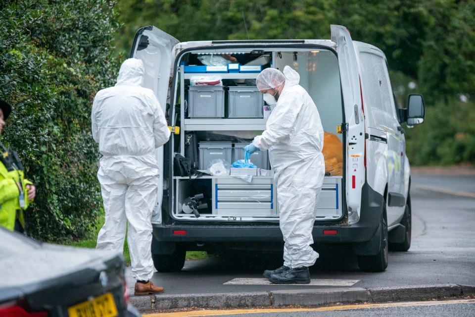 The man was found stabbed in a crashed car near hospital, sparking a murder probe