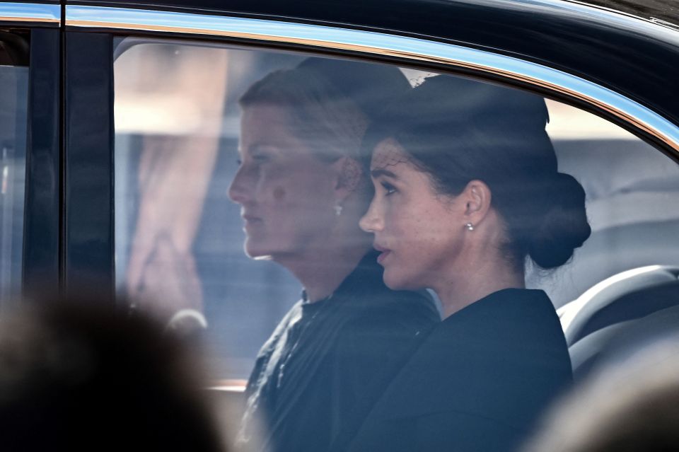 Sophie, Countess of Wessex and Meghan, Duchess of Sussex are driven behind the coffin of Queen Elizabeth II