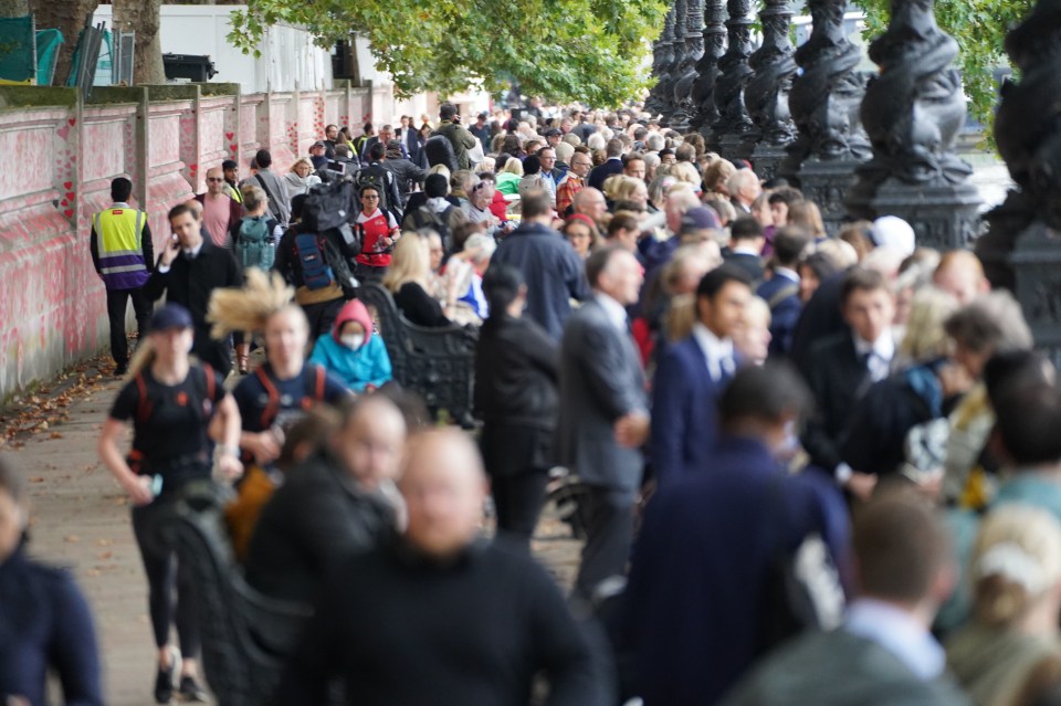 Members of the public join the queue on the South Bank near to Lambeth Bridge