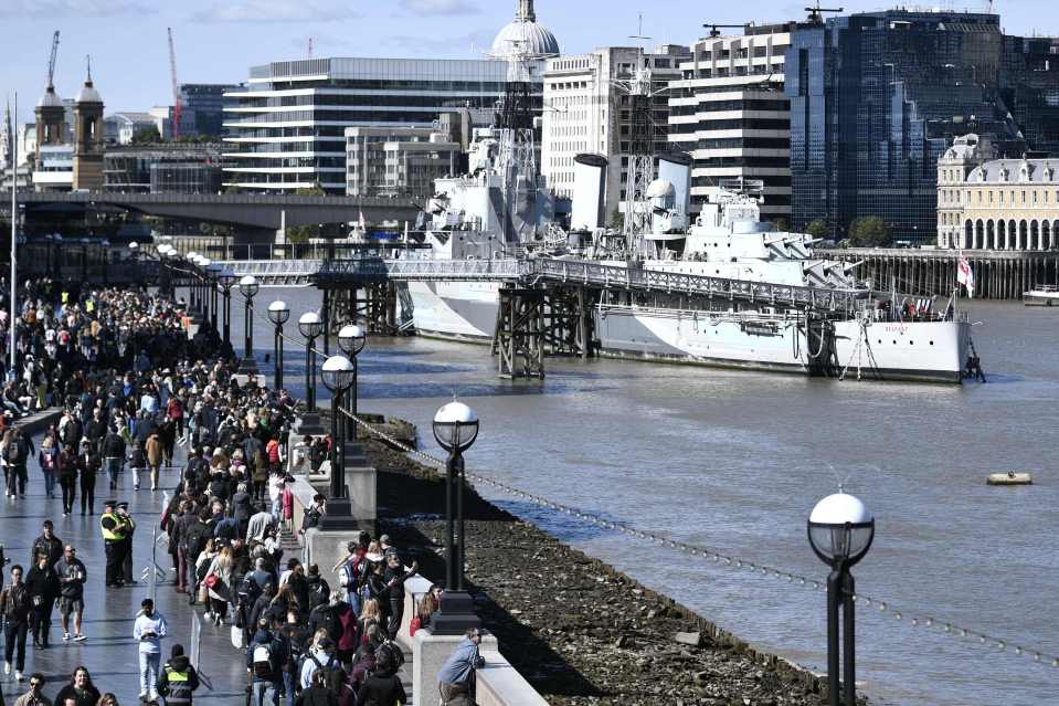 Members of the public stand in the queue to pay their respects to the late Queen Elizabeth II