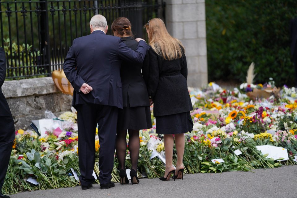 Andrew comforted his daughter Princess Eugenie as she began to cry