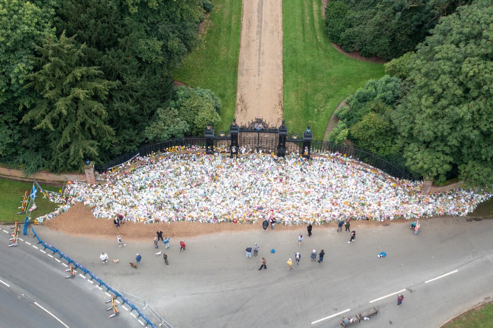 A huge sea of flowers has been left by mourners outside of the Queen's Sandringham Estate