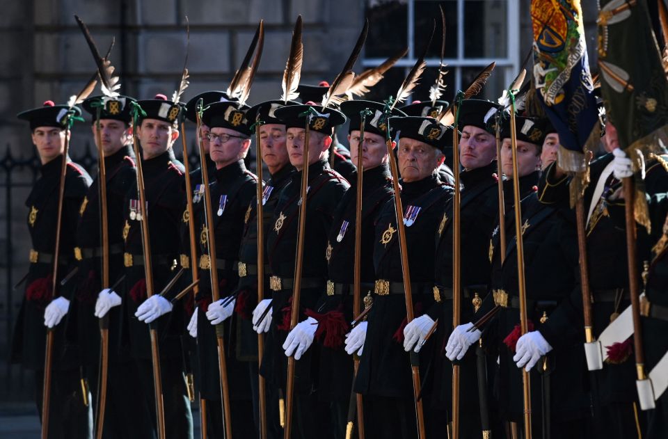 The Royal Company of Archers stand on guard outside the cathedral