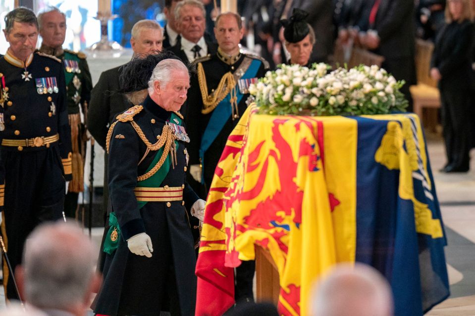 King Charles walks past his mother's coffin during a Thanksgiving service on Monday