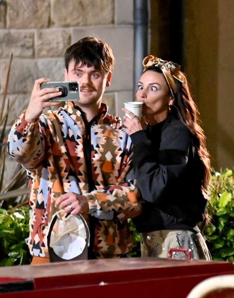 Michelle pulled faces while taking a selfie with co star Tom Hanson who plays Cardi