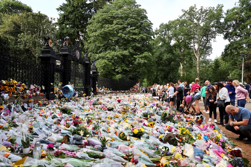 Bouquets piled up at Sandringham with well-wishers waiting patiently for hours to leave tributes