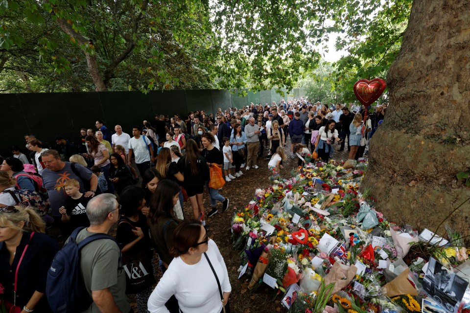 Crowds gather to pay tribute to the Queen in Green Park yesterday