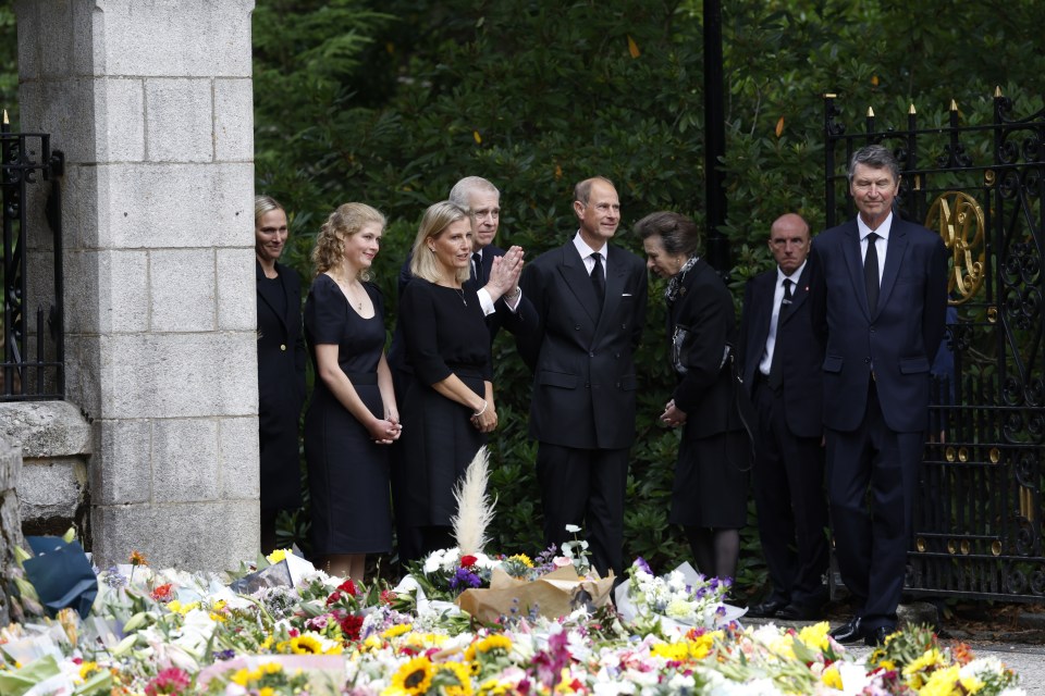 Members of the Royal family meet the public and view the flowers at the gates of Balmoral Castle