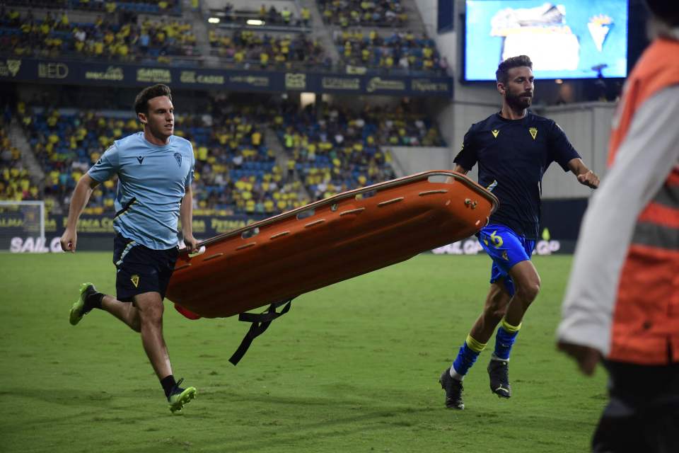 The fan was whisked away on a stretcher to an ambulance