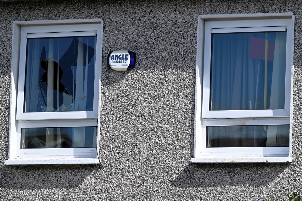 A smashed window where the ‘bloodbath’ took place