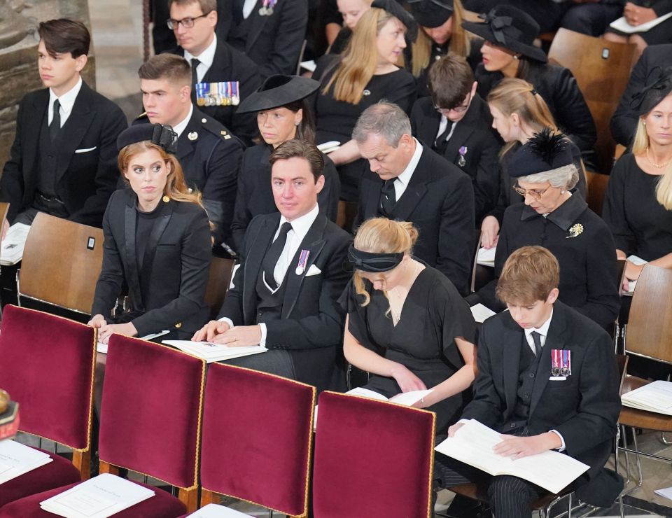 James, right, was sat next to his sister for the state funeral