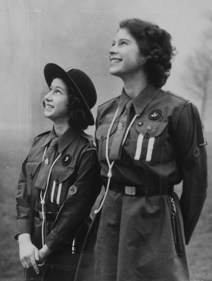 Princess Margaret and Princess Elizabeth appear in uniform with the Girl Guides