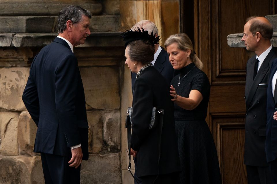 Princess Anne was comforted by The Countess of Wessex as the Queen's coffin was brought inside Holyroodhouse