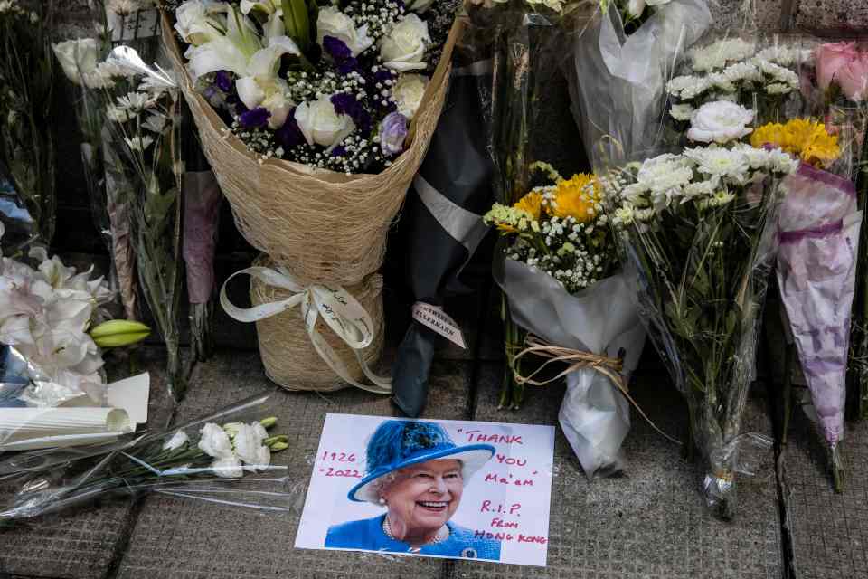 Flowers and tributes were left outside the British Consulate-General in Hong Kong