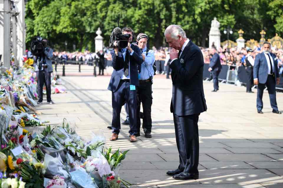 The royal had a moment of reflection as he took in the floral tributes