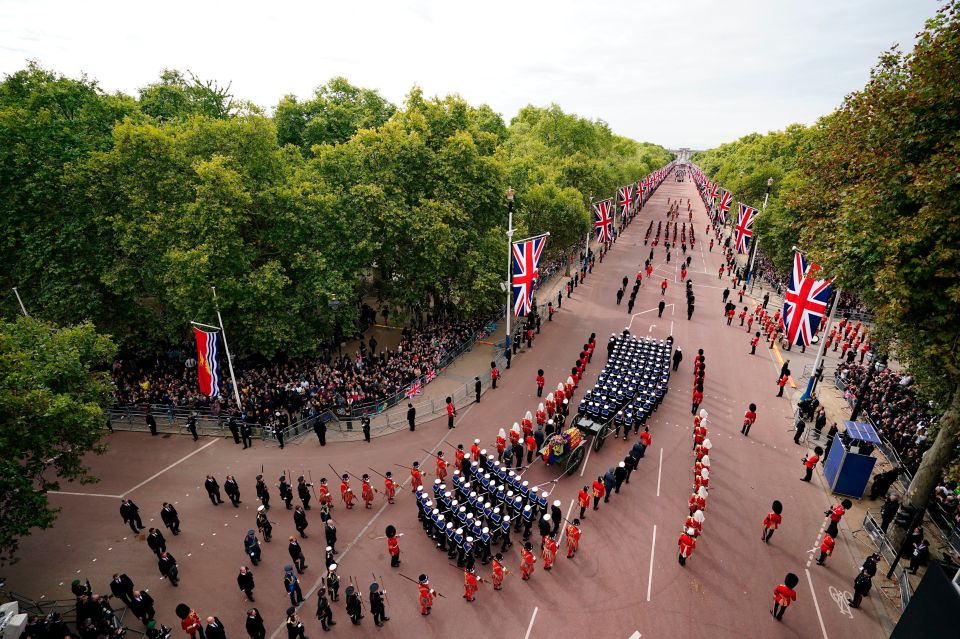 Thousands lined the streets as the procession made its way along the Mall