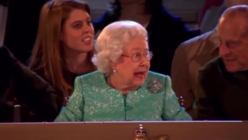 Queen Elizabeth reacts with joy as she spots a herd of cows