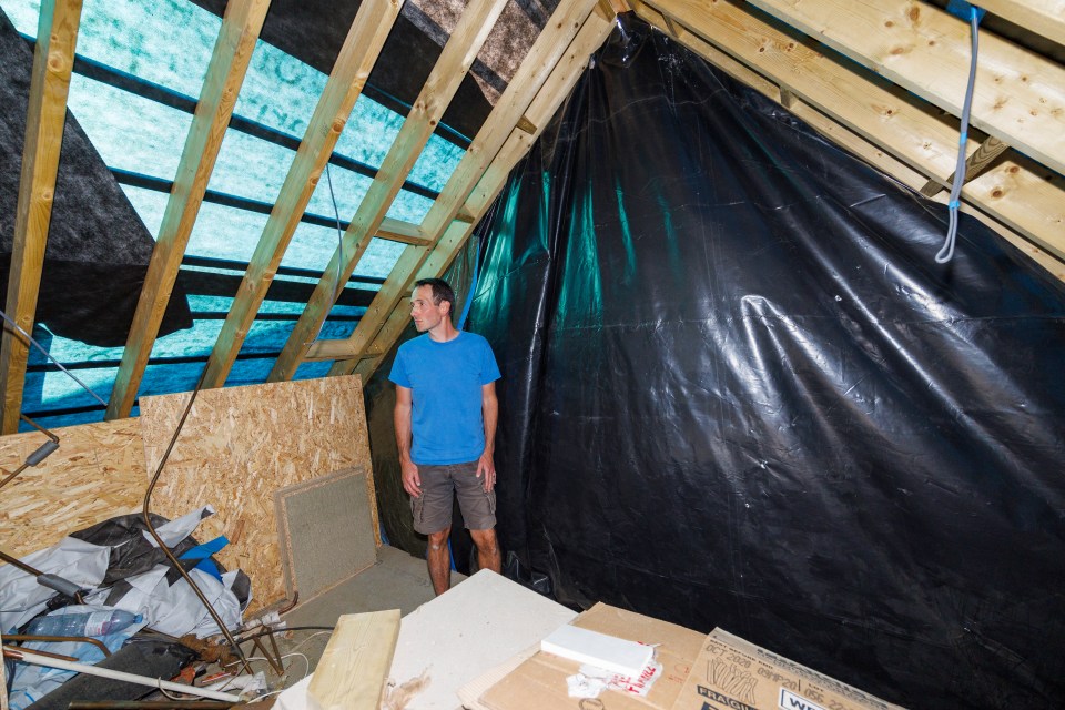 Dan in the loft area, which he says was supposed to be finished months ago