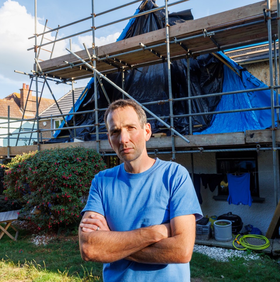 Dan outside his 'bomb site' home in Bexhill-on-Sea, East Sussex