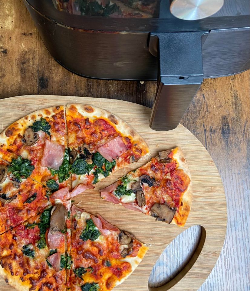 You can use an air fryer to cook an oven pizza from frozen