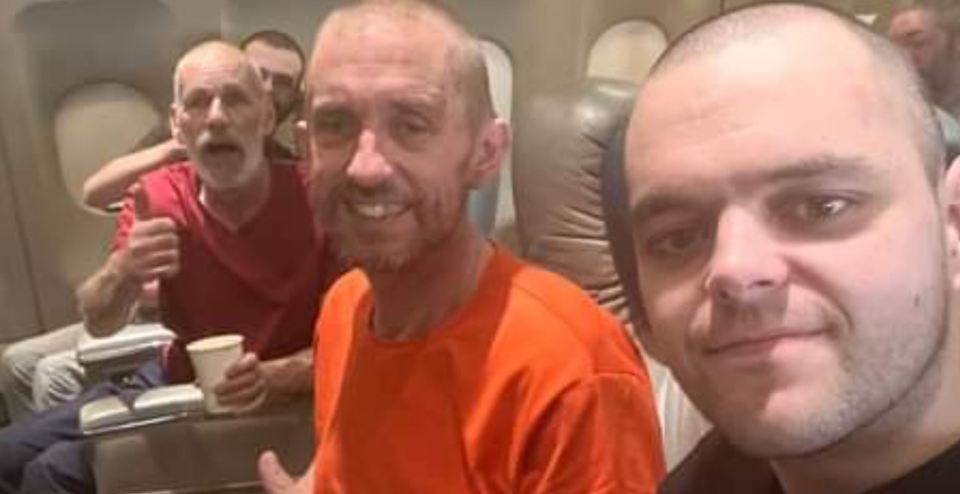 Aiden Aslin and Shaun Pinner, pictured with John Harding, recorded a message for his supporters while on the plane to Saudi Arabia