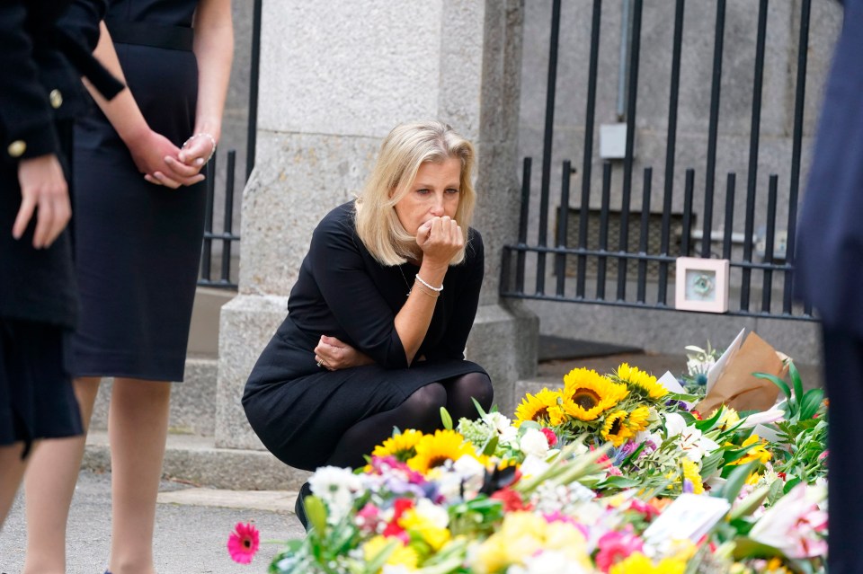 Sophie, Countess of Wessex views the messages and floral tributes left at Balmoral