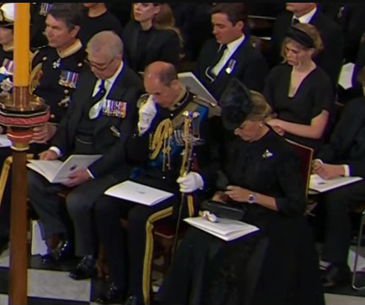 Prince Edward wipes away the tears during the service