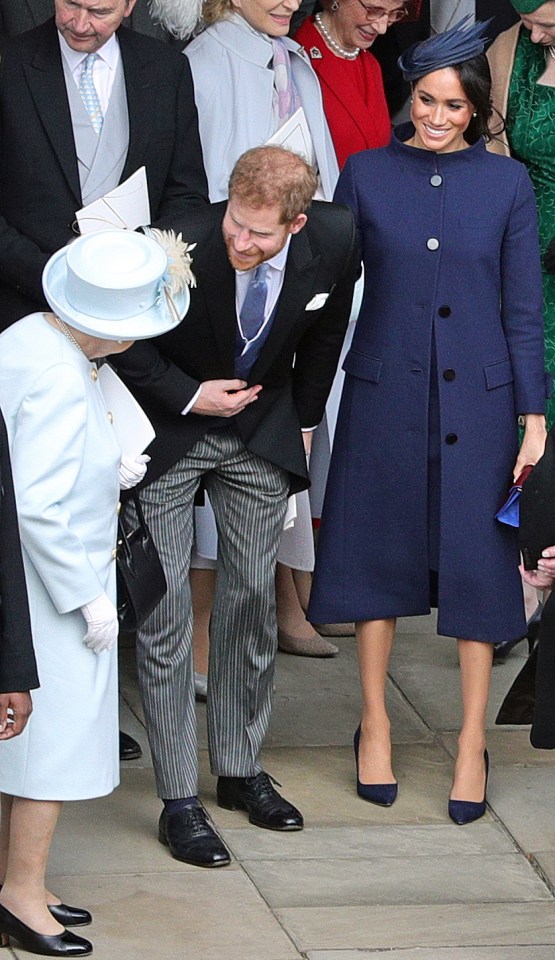 The Queen laughs with the Duke and Duchess of Sussex after Princess Eugenie's wedding in 2018