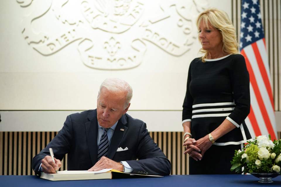 Joe Biden signs a book of condolence at the British Embassy in Washington