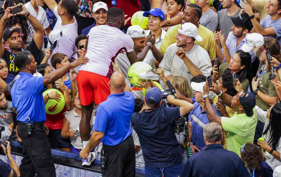 Tiafoe climbed into the crowd to celebrate with his team after beating Nadal