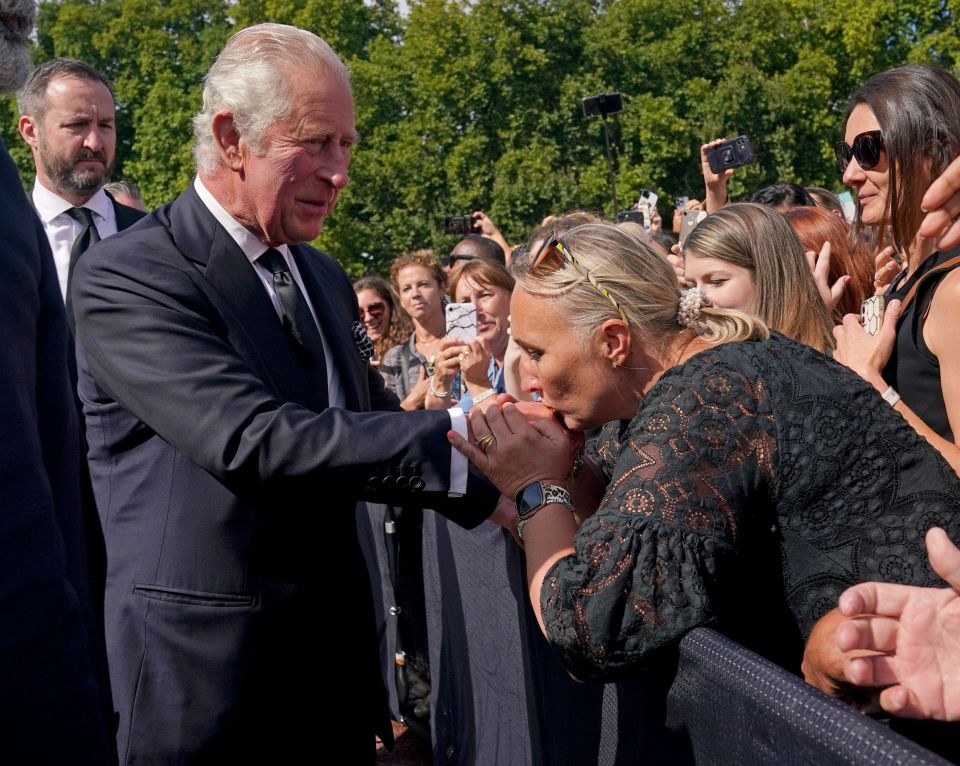 Another royal fan planted a peck on the King's hand in a touching gesture