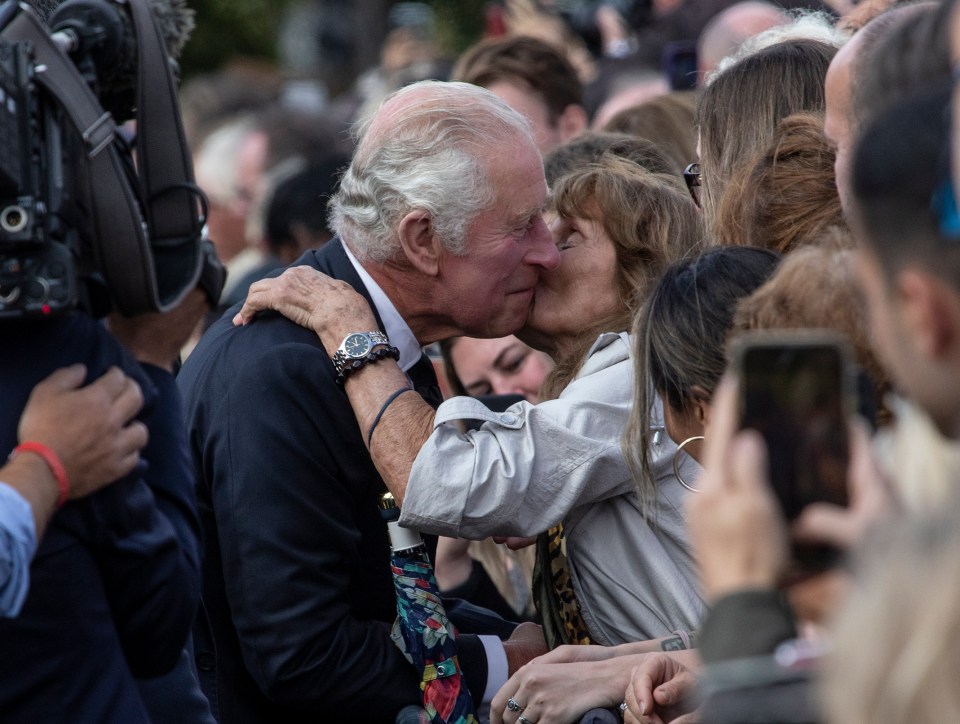 King Charles received a kiss on the cheek as he arrived at Buckingham Palace