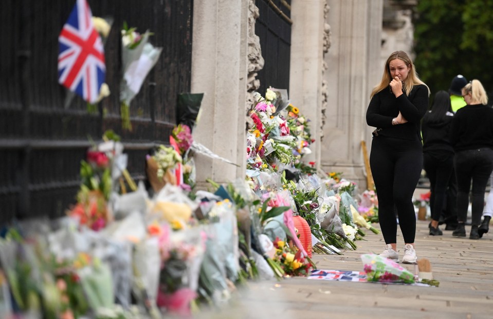 Tearful Brits have left a sea of tributes for the Queen outside Royal palaces