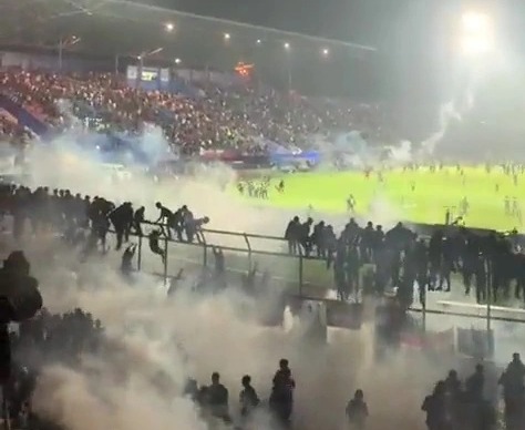 Riot police lobbed tear gas and charged at supporters