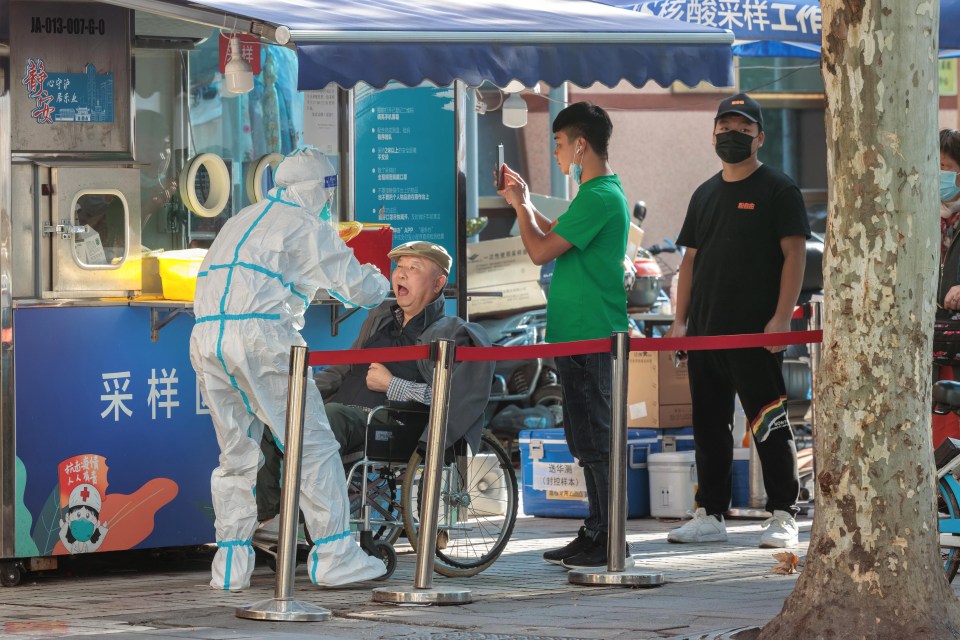 People stand in line for Coronavirus PCR test in Shanghai