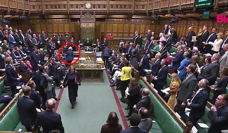 Truss pictured sneaking out of the House Of Commons