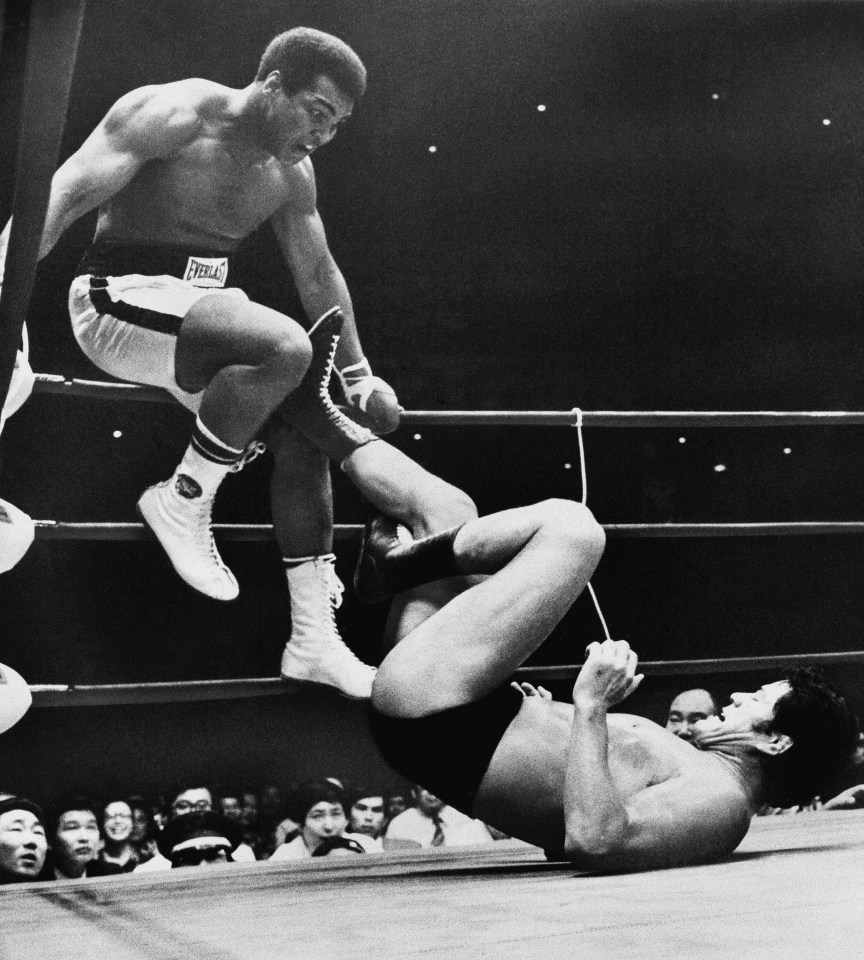 World heavyweight boxing champion Muhammad Ali trying to evade kicks by wrestler Antonio Inoki