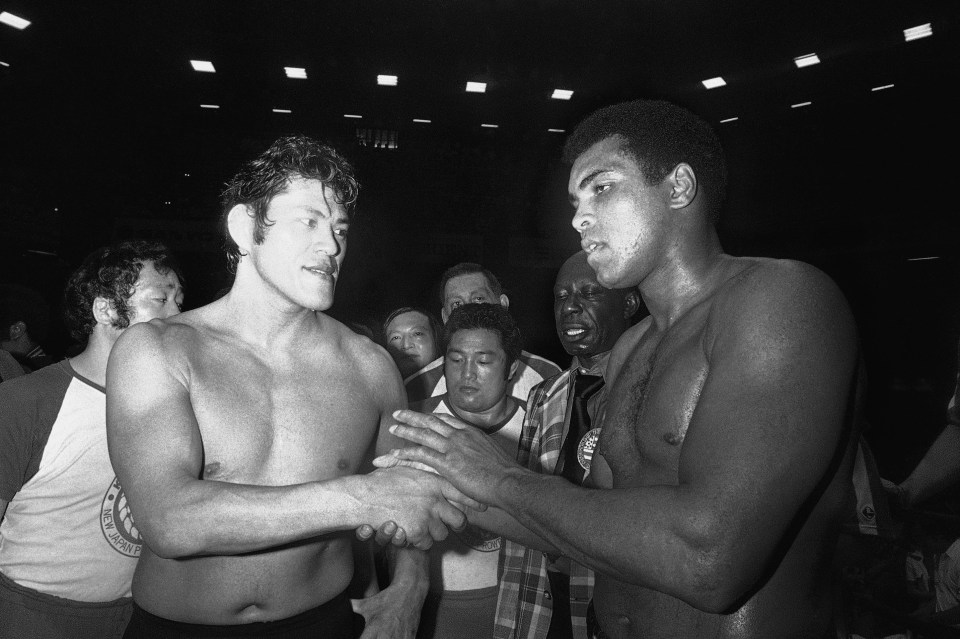 Antonio Inoki, left, with world heavyweight boxing champion Muhammad Ali