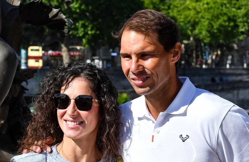 Rafael Nadal poses with his wifeafter a photoshoot for his 14th victory at Roland Garros in June this year