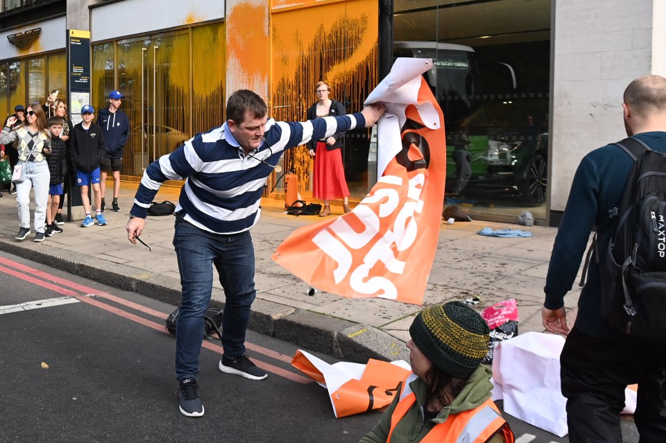 Anger from public grows as Just Stop Oil protesters block traffic and spray an Aston Martin dealership with orange paint