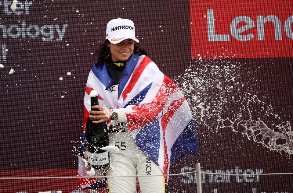 Jenner Racing’s Jamie Chadwick celebrates on the podium after winning the WSeries race