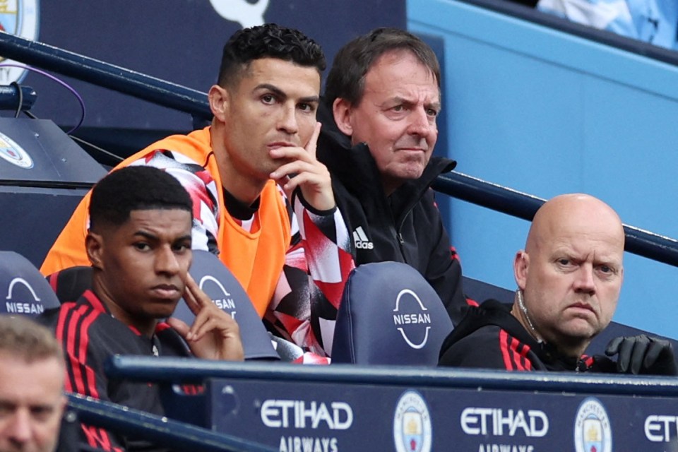 Ronaldo, 37, watches on from the bench