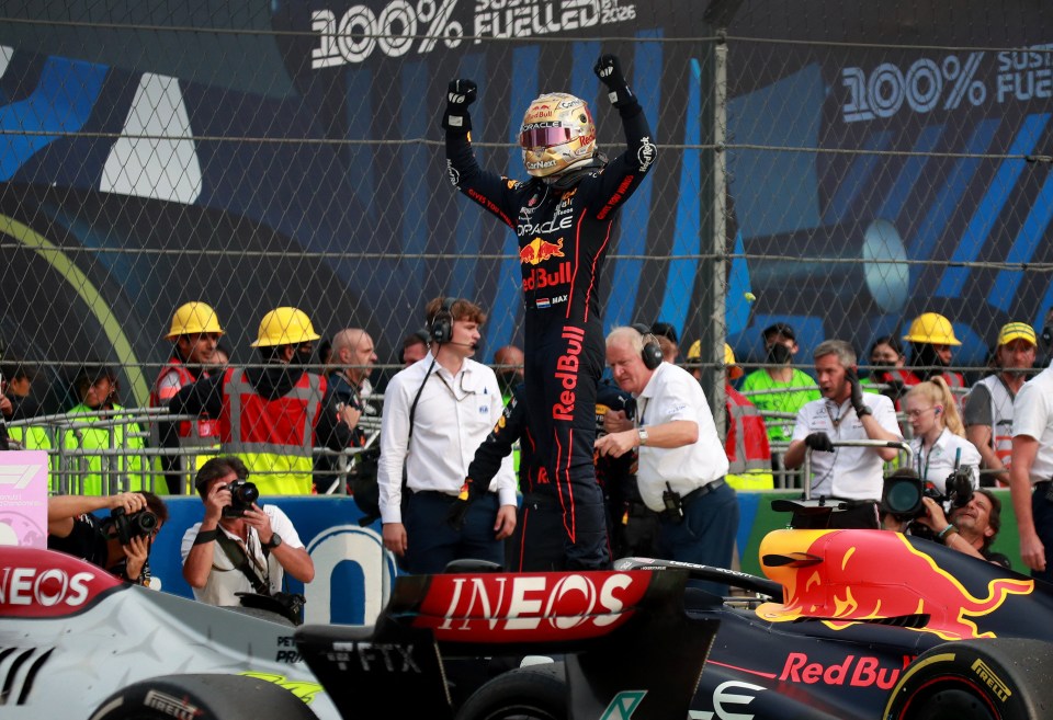 Red Bull’s Max Verstappen celebrates winning a record 14th GP of the year