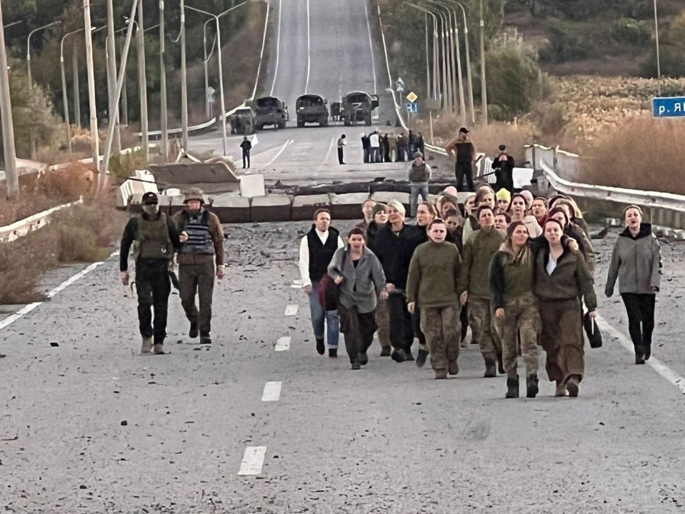 The freed women walking back to Ukrainian lines