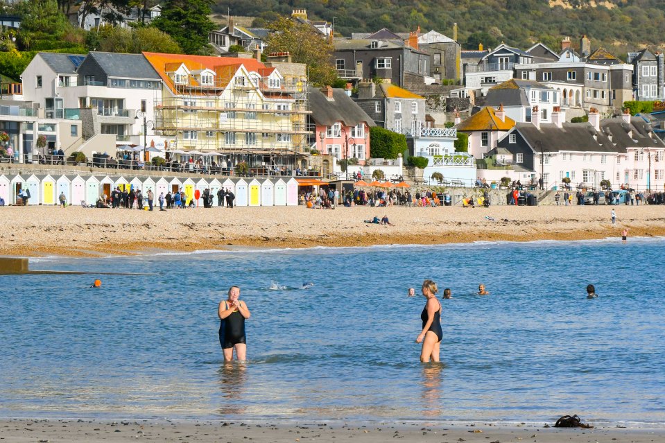 It was warm enough recently for people to be able to take a dip in the sea at Lyme Regis