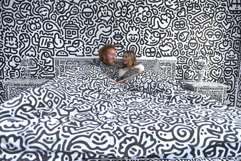 Sketch pad... Sam and wife Alena try out doodle-themed bed